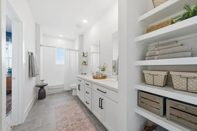 a bathroom with a double vanity sink and mirror