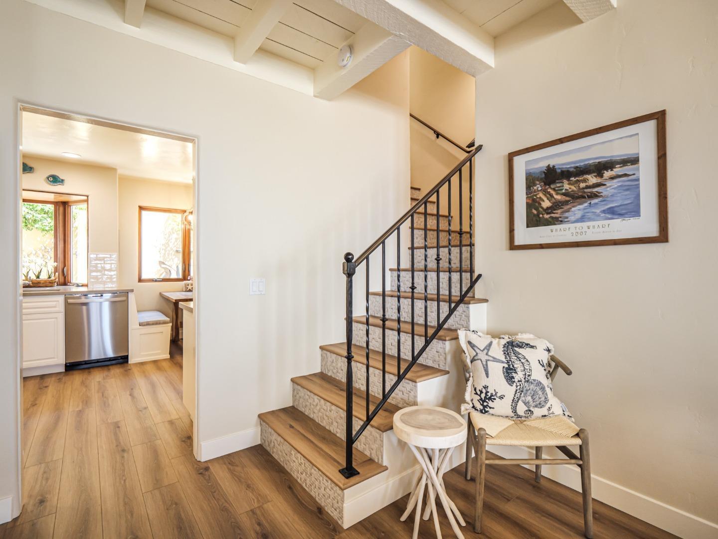 431 Beach Drive Aptos, CA 95003 - Photo 11 of 47 a view of a hallway with wooden floor and staircase