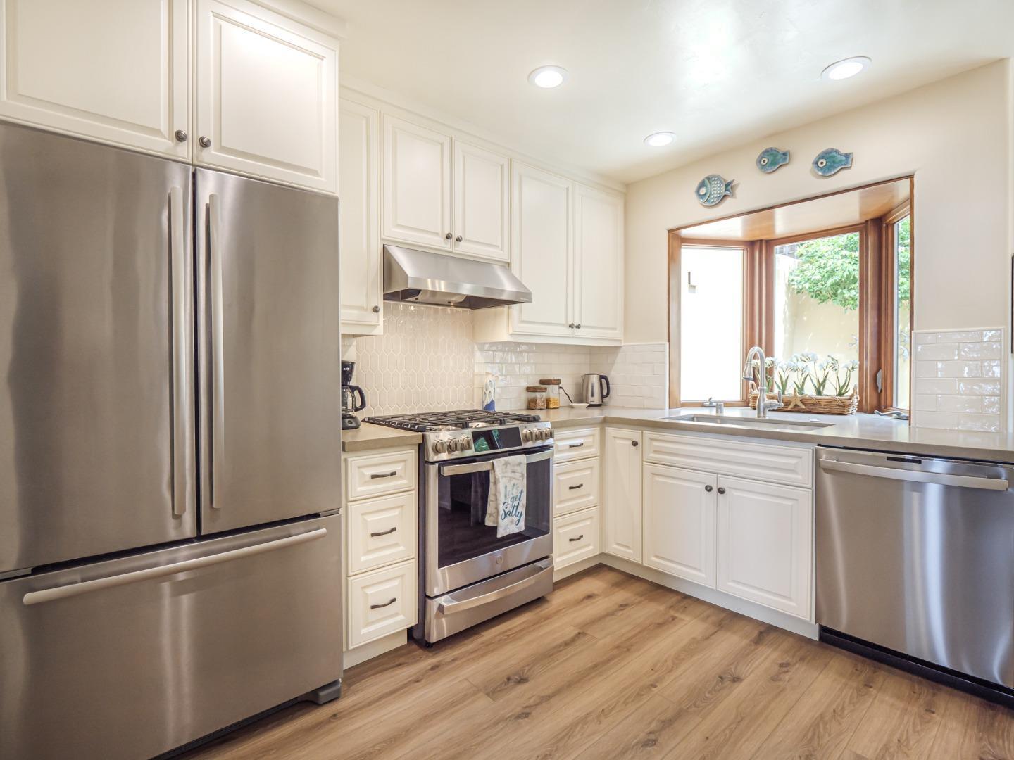 431 Beach Drive Aptos, CA 95003 - Photo 13 of 47 a kitchen with stainless steel appliances a refrigerator a sink and cabinets
