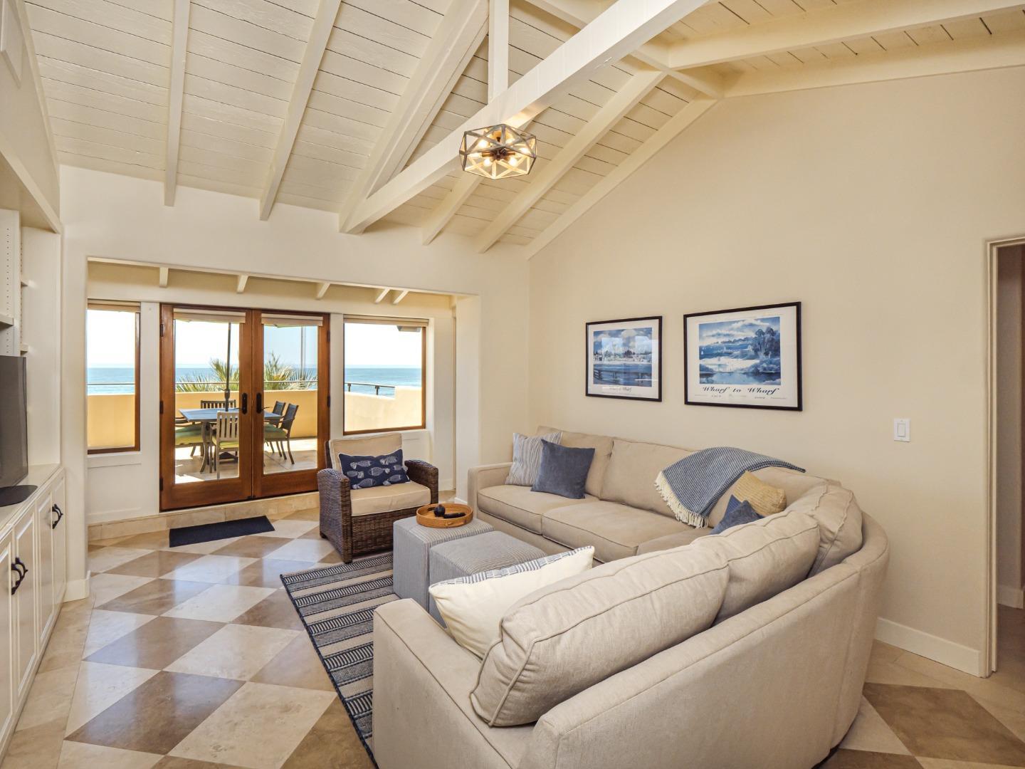 431 Beach Drive Aptos, CA 95003 - Photo 16 of 47 a living room with furniture and a floor to ceiling window