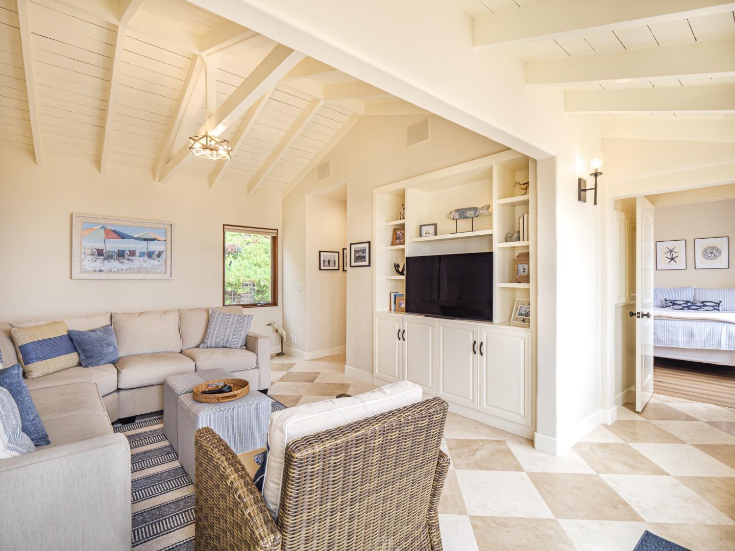 431 Beach Drive Aptos, CA 95003 - Photo 19 of 47 a living room with furniture and a flat screen tv