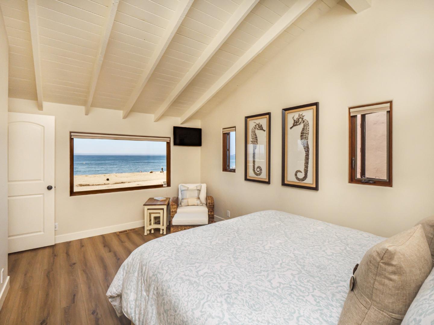 431 Beach Drive Aptos, CA 95003 - Photo 20 of 47 a bedroom with a large bed and a couch