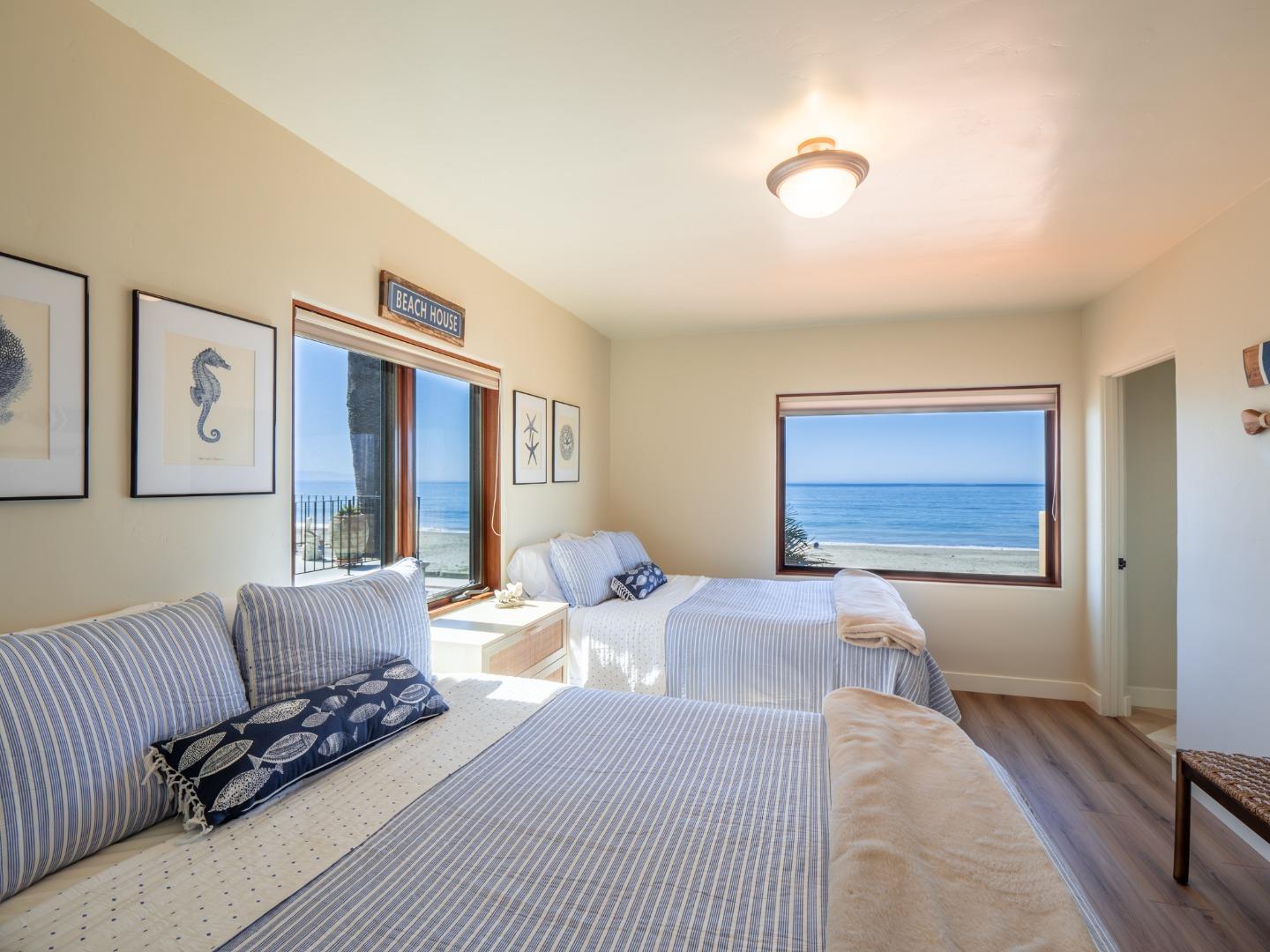 431 Beach Drive Aptos, CA 95003 - Photo 23 of 47 a bedroom with a large bed and a couch