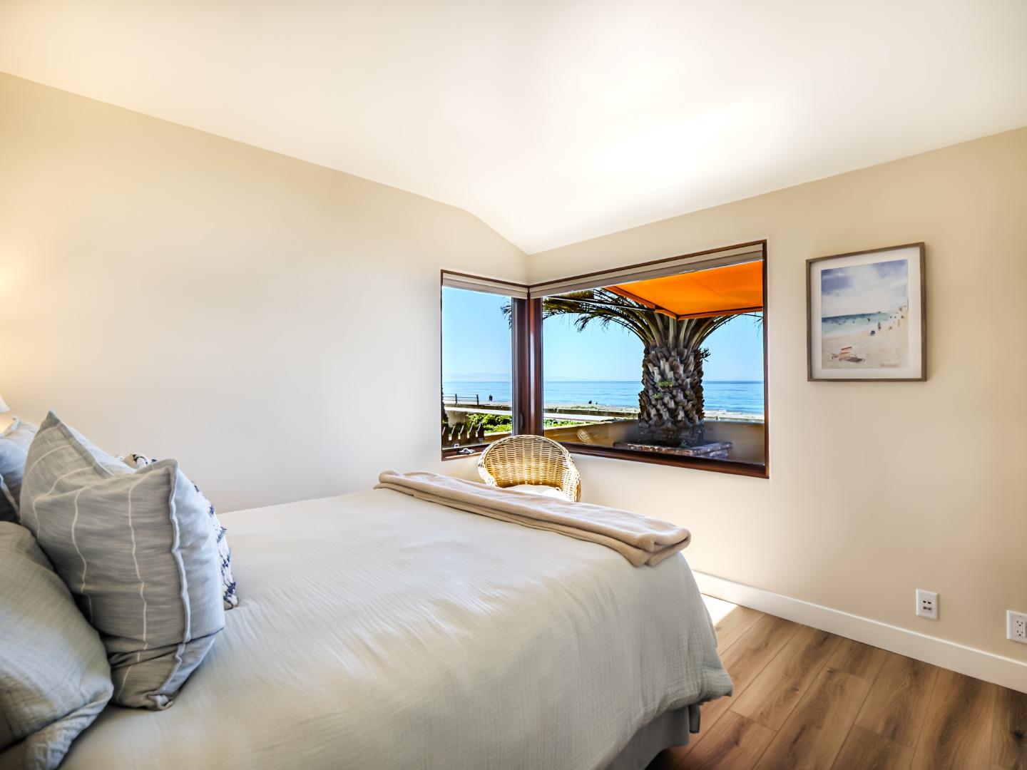 431 Beach Drive Aptos, CA 95003 - Photo 28 of 47 a bedroom with a bed and a large window