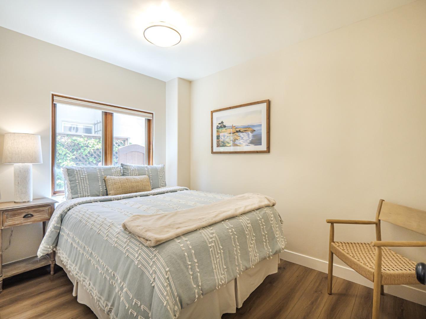 431 Beach Drive Aptos, CA 95003 - Photo 30 of 47 a bedroom with a bed and a large window