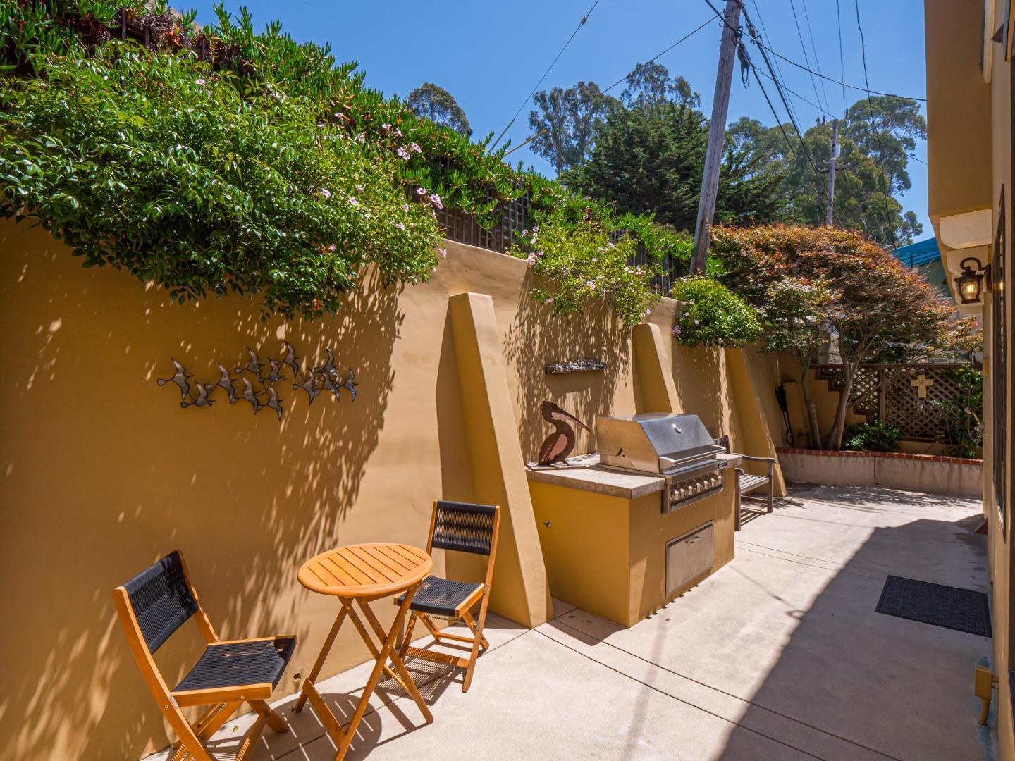 431 Beach Drive Aptos, CA 95003 - Photo 32 of 47 a view of a chairs and table in patio