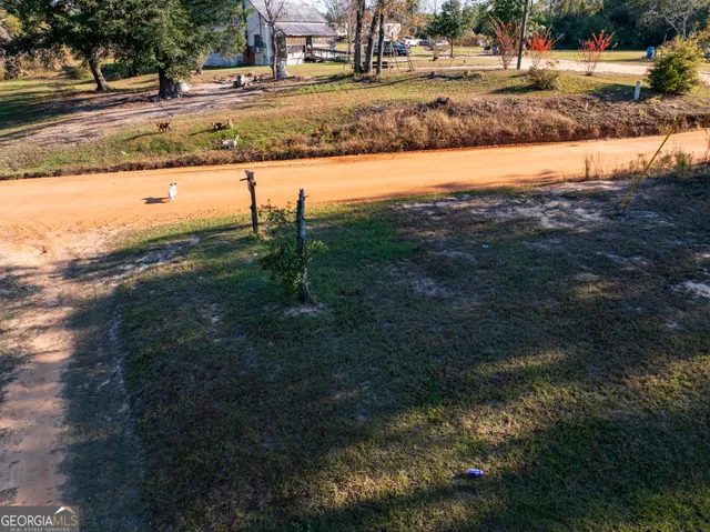 a view of a backyard of the house