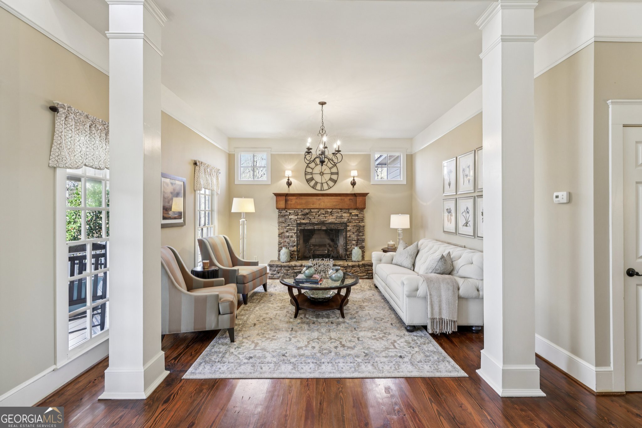 1015 Adams Road West Point, GA 31833 - Photo 12 of 108 a living room with furniture a fireplace and a chandelier