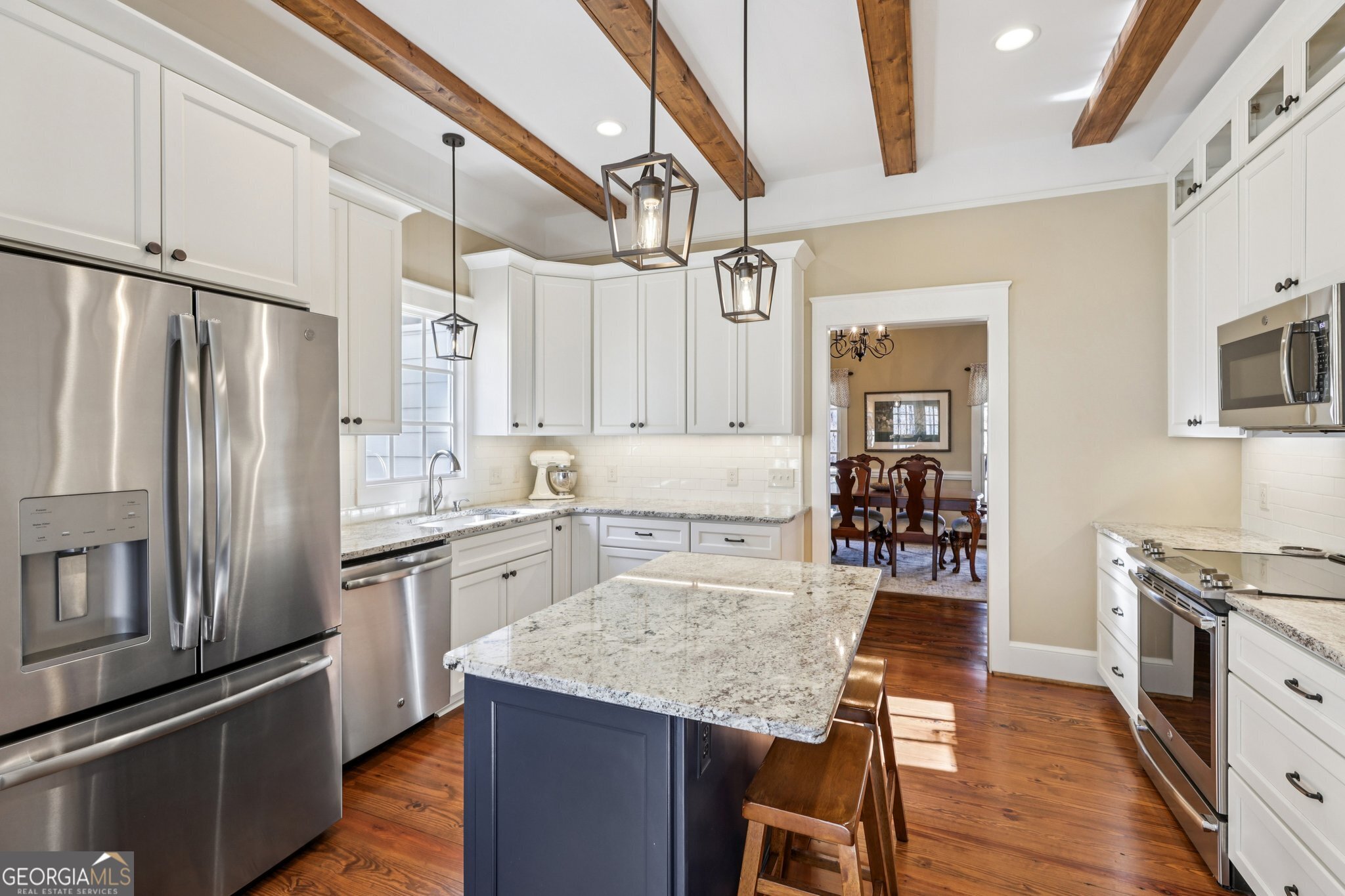 1015 Adams Road West Point, GA 31833 - Photo 18 of 108 a kitchen with granite countertop a refrigerator stove top oven and sink