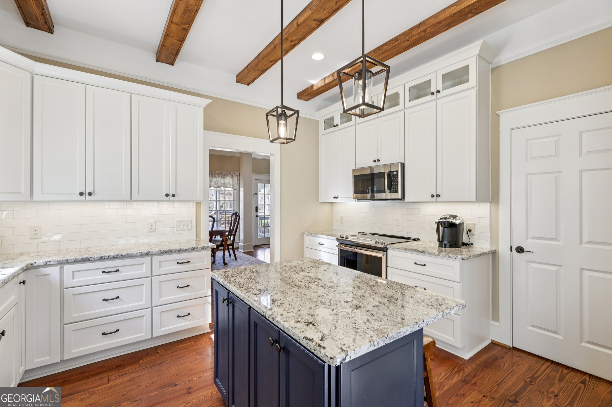 1015 Adams Road West Point, GA 31833 - Photo 20 of 108 a kitchen with stainless steel appliances granite countertop a stove and a sink