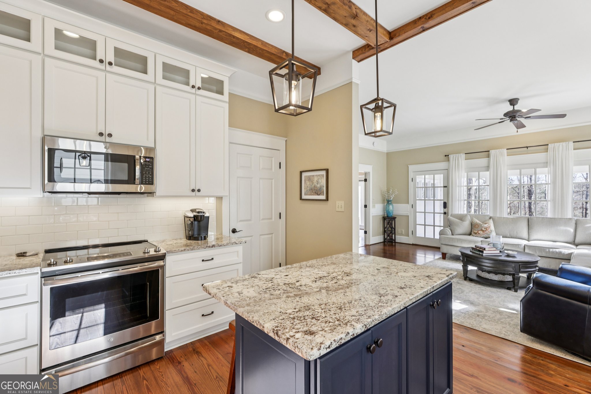 1015 Adams Road West Point, GA 31833 - Photo 22 of 108 a kitchen with stainless steel appliances granite countertop a sink stove and refrigerator