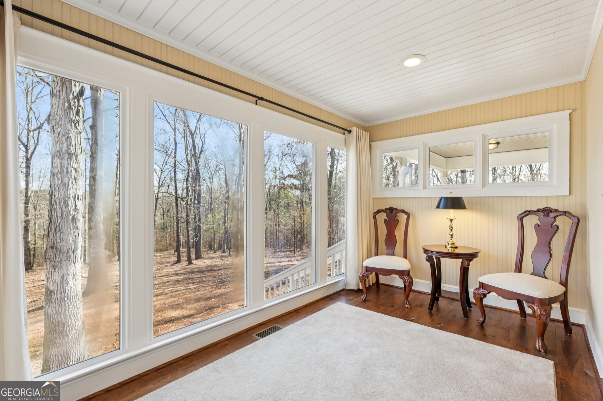 1015 Adams Road West Point, GA 31833 - Photo 33 of 108 a living room with furniture and a floor to ceiling window