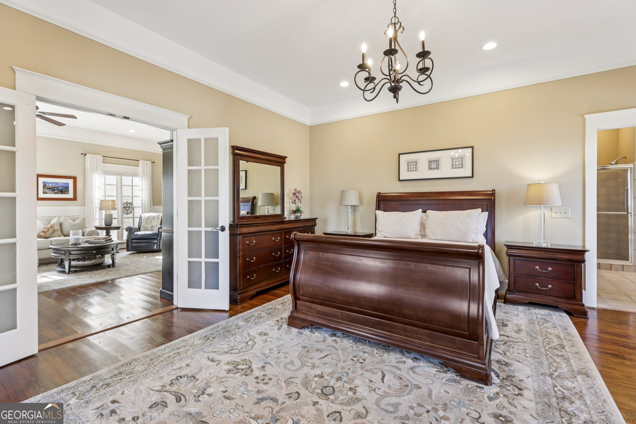 1015 Adams Road West Point, GA 31833 - Photo 36 of 108 a bedroom with a bed and a chandelier