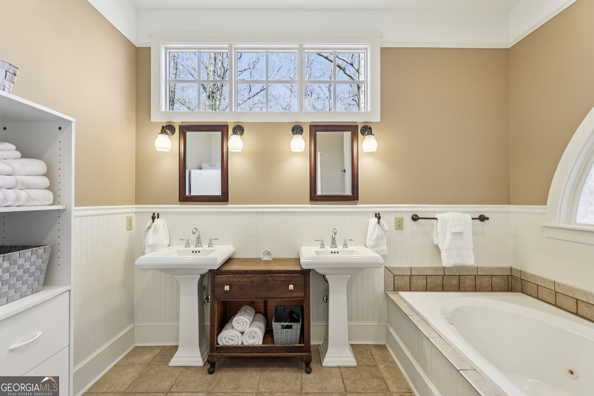 1015 Adams Road West Point, GA 31833 - Photo 38 of 108 a bathroom with a tub sink and mirror