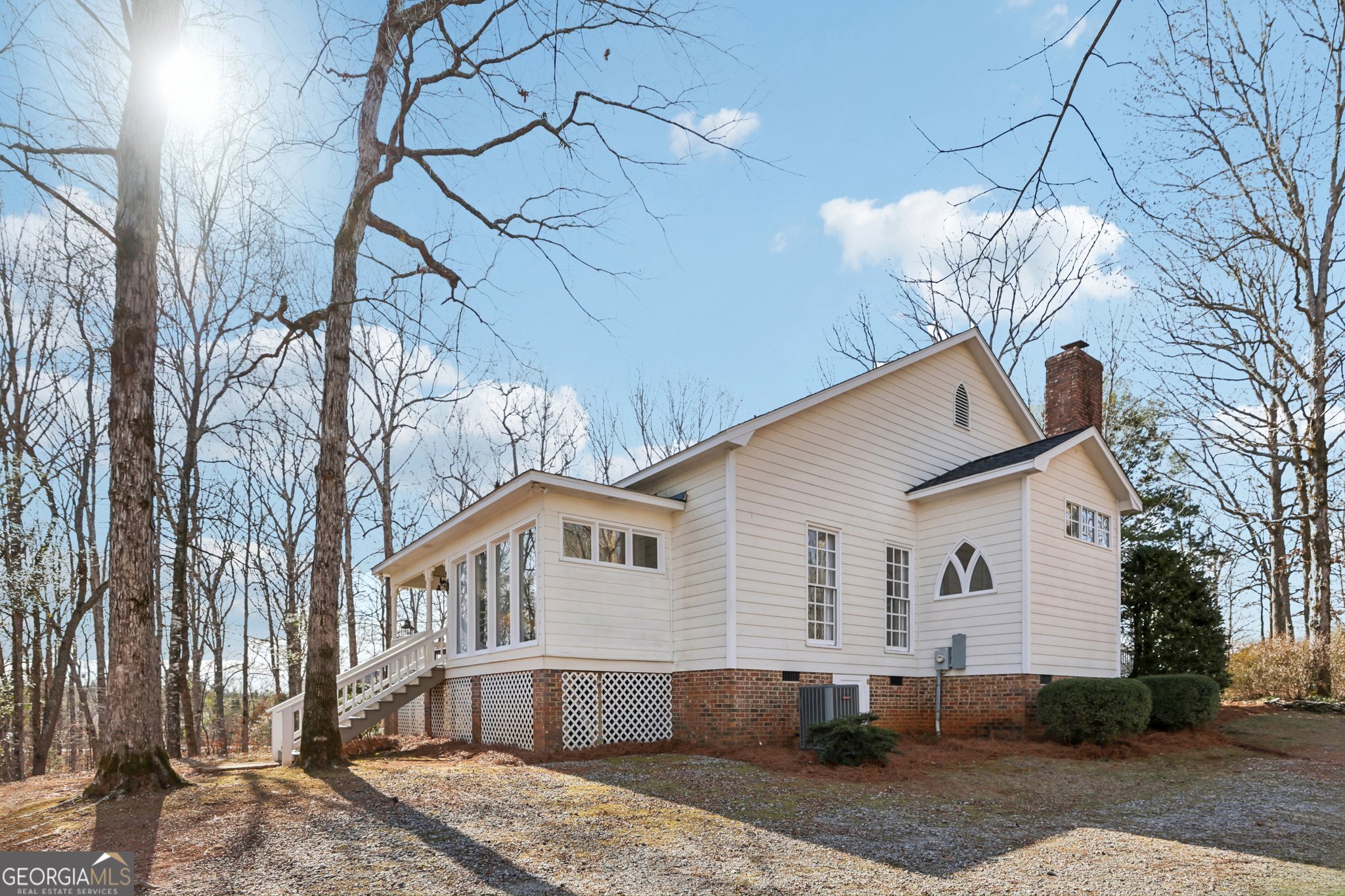 1015 Adams Road West Point, GA 31833 - Photo 60 of 108 a front view of a house with a yard and potted plants