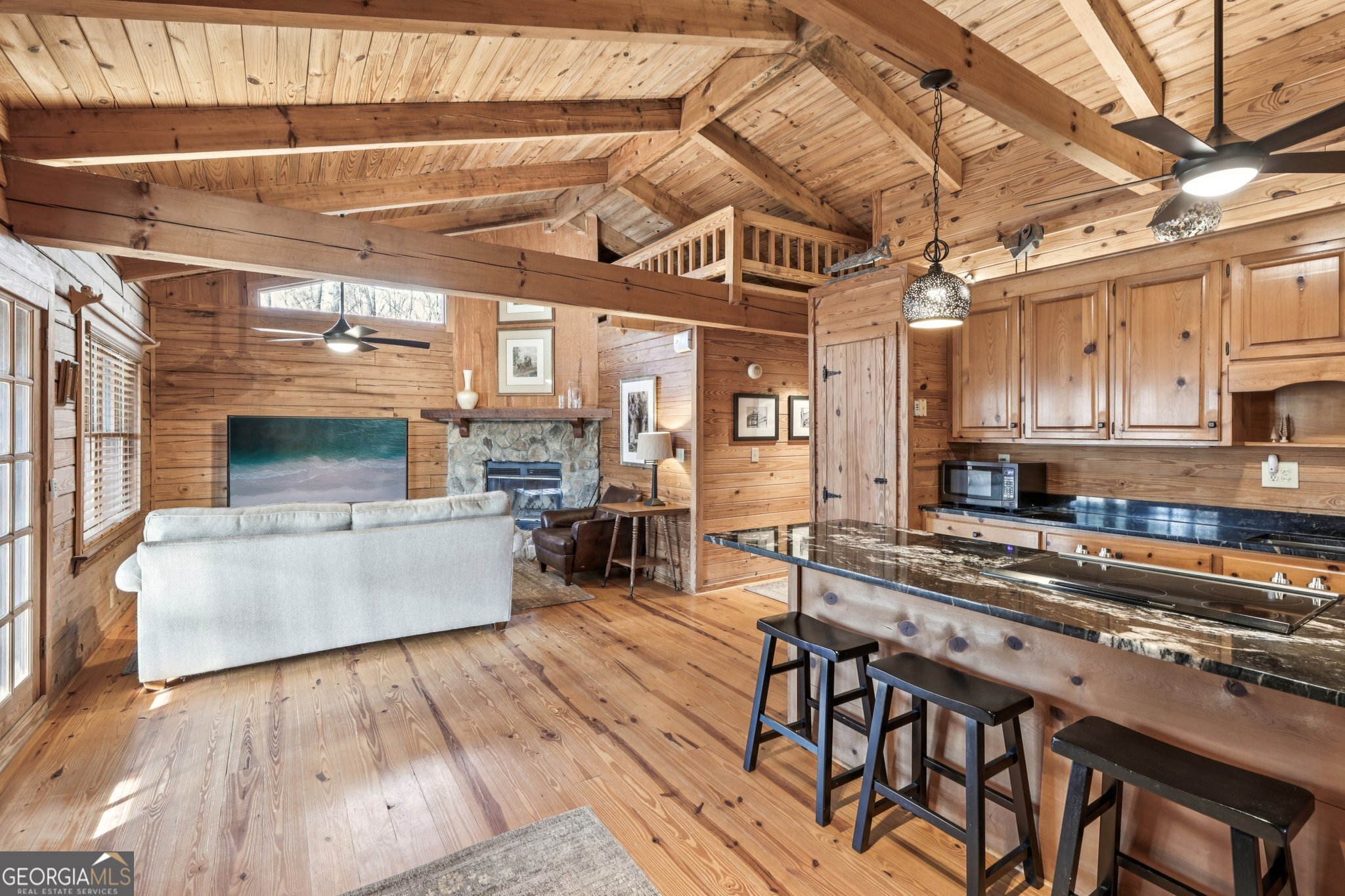 1015 Adams Road West Point, GA 31833 - Photo 76 of 108 a kitchen with stainless steel appliances granite countertop a stove and a wooden floors