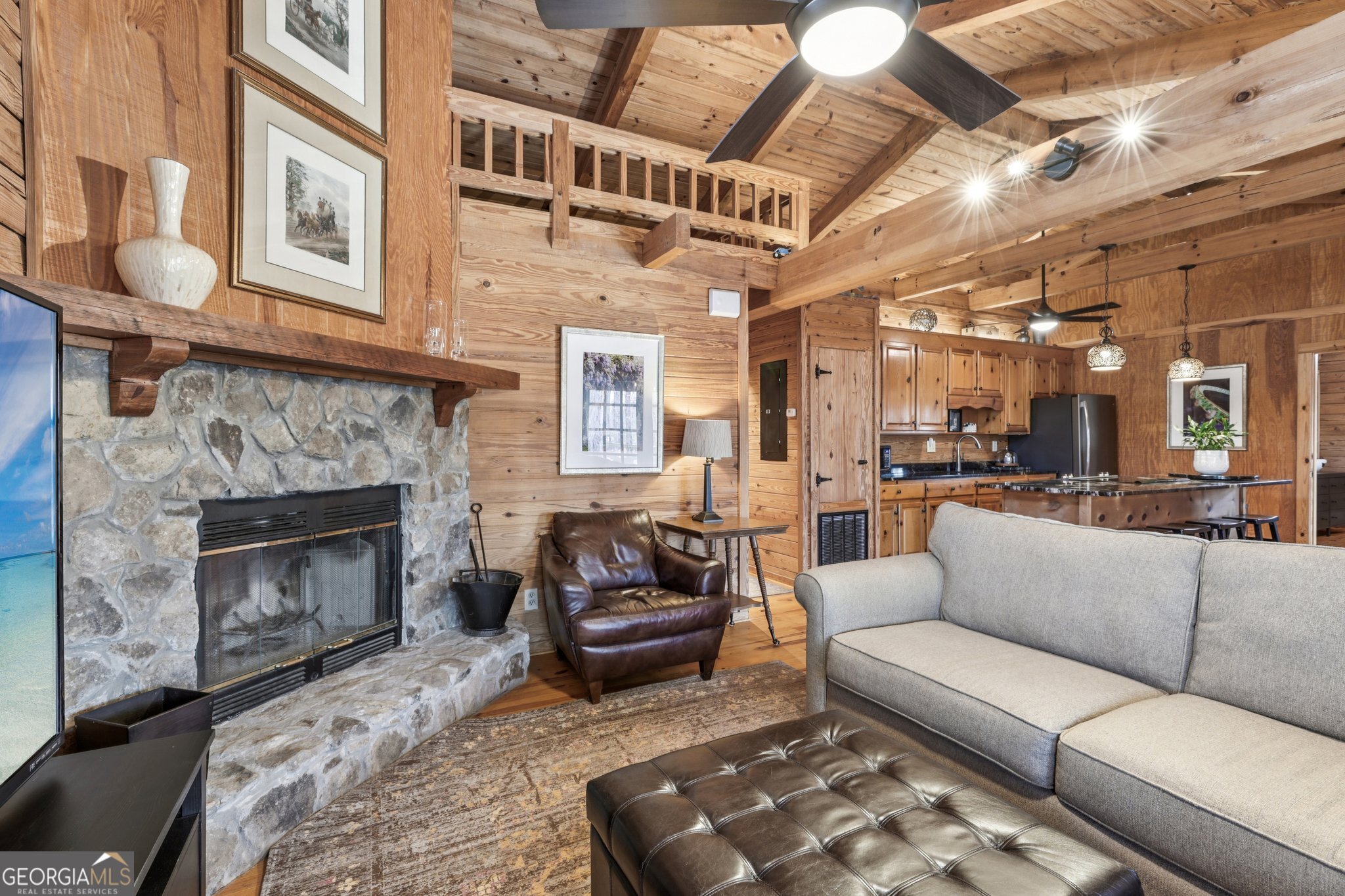 1015 Adams Road West Point, GA 31833 - Photo 79 of 108 a living room with furniture a fireplace and a chandelier