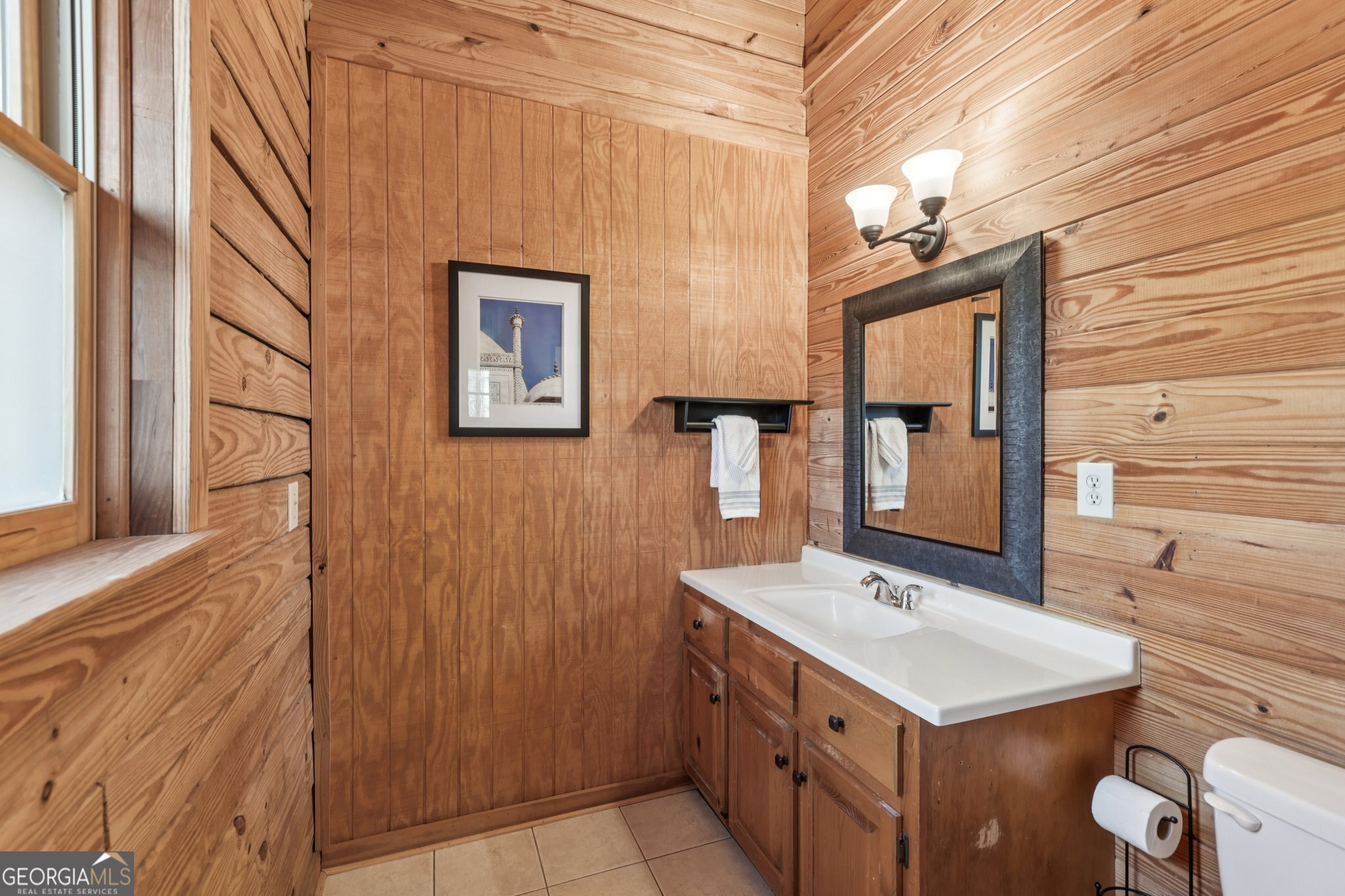 1015 Adams Road West Point, GA 31833 - Photo 95 of 108 a bathroom with a sink vanity and a mirror