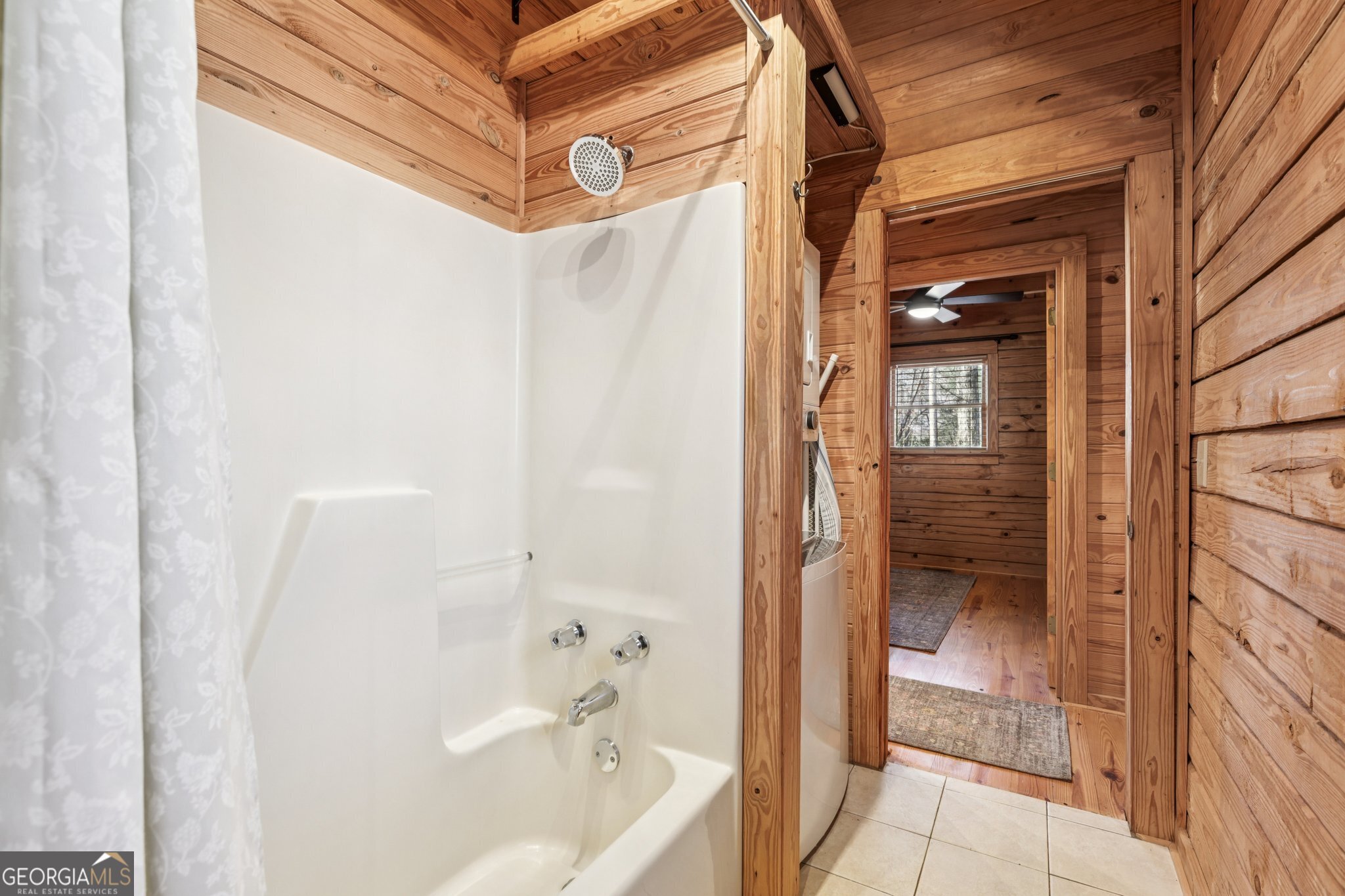 1015 Adams Road West Point, GA 31833 - Photo 96 of 108 a bathroom with a bathtub and a shower