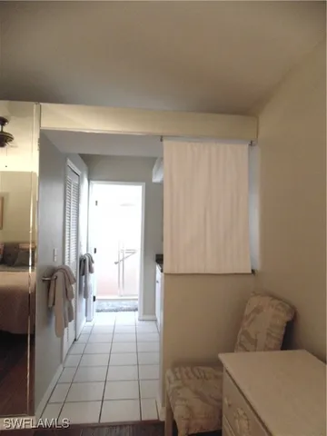 a spacious bathroom with a granite countertop sink and a mirror