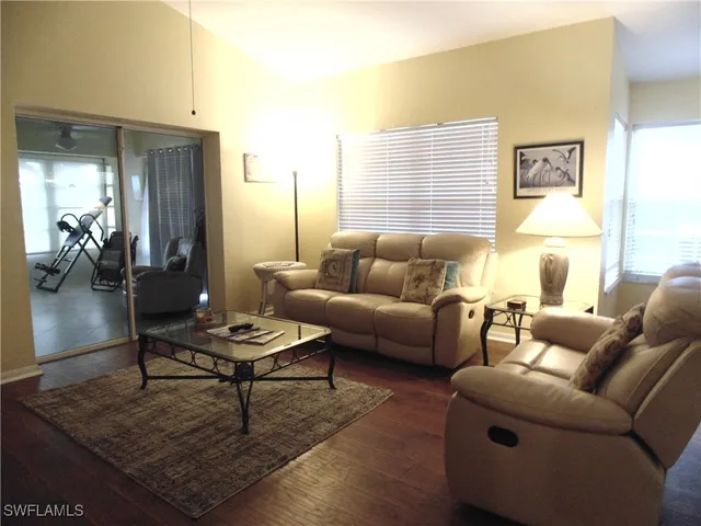 a living room with furniture and a table