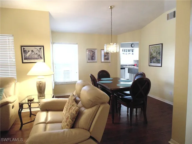 a work room with furniture and a window