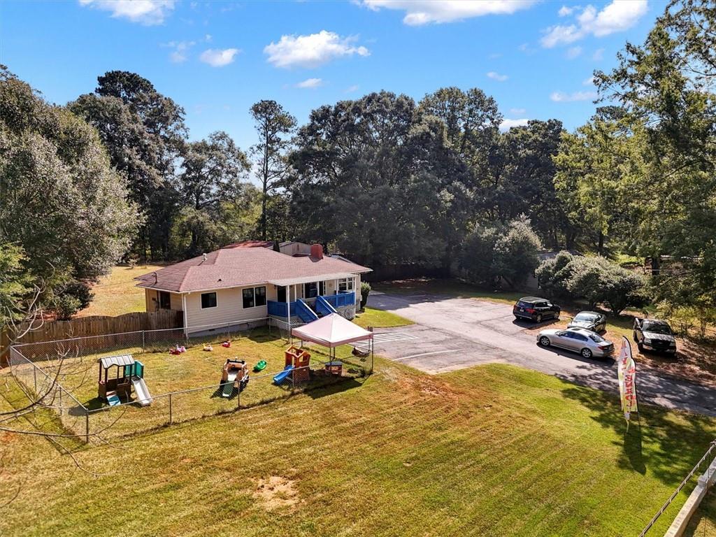 5099 Austell Powder Springs Road Southwest Austell, GA 30106 - Photo 2 of 38 an outdoor space with pool and furniture