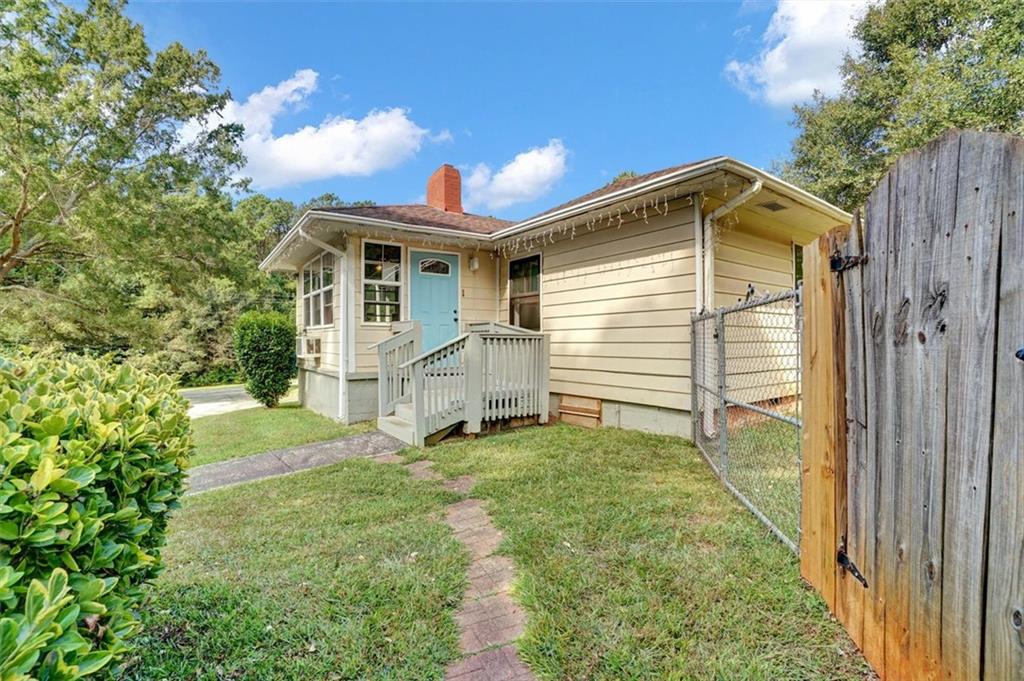 5099 Austell Powder Springs Road Southwest Austell, GA 30106 - Photo 27 of 38 a view of a house with a yard