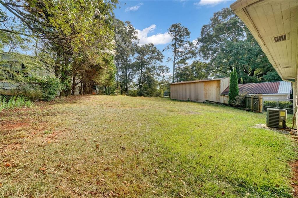 5099 Austell Powder Springs Road Southwest Austell, GA 30106 - Photo 31 of 38 a view of an outdoor space and a yard