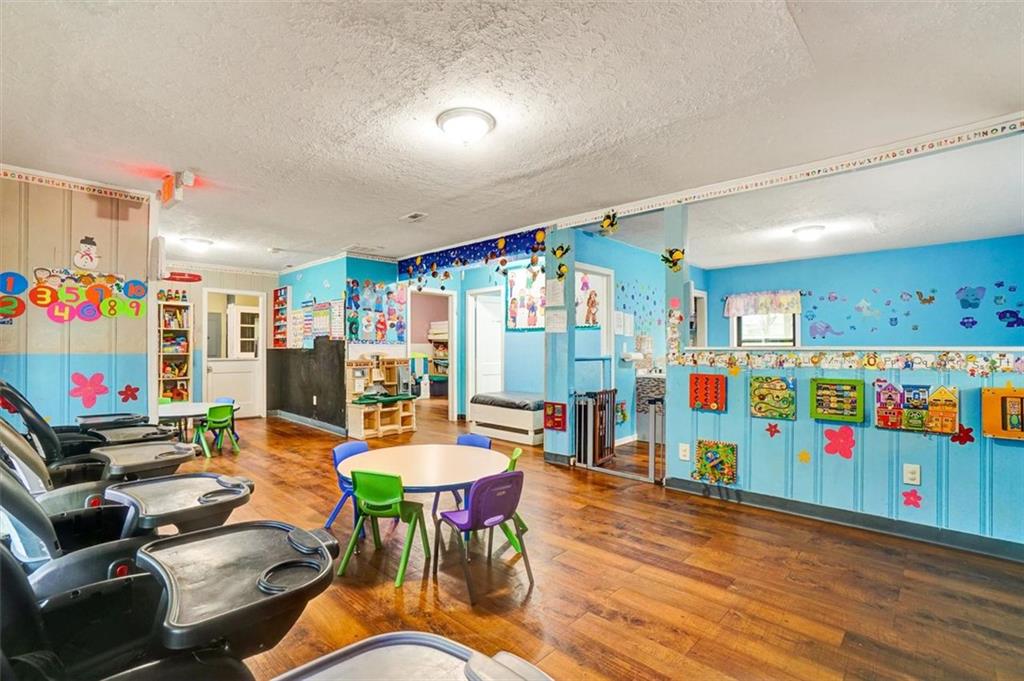 5099 Austell Powder Springs Road Southwest Austell, GA 30106 - Photo 8 of 38 a reading room with furniture and toys