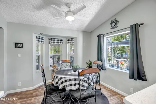 a view of a dining room with furniture window and outside view