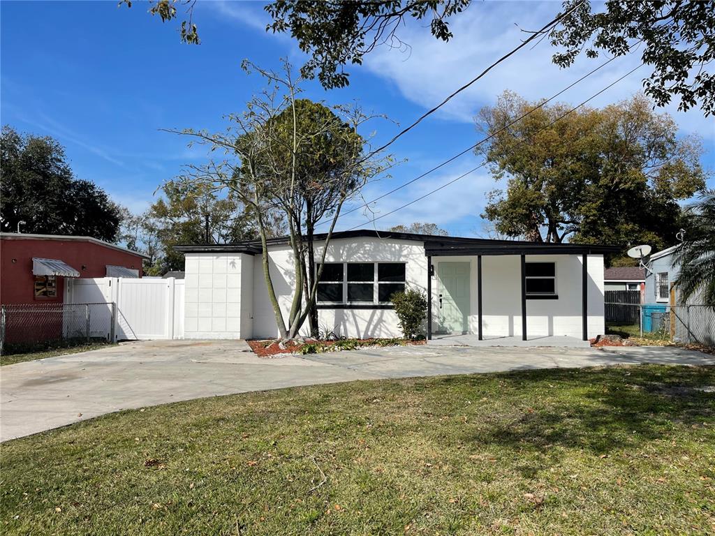 a house view with a backyard space