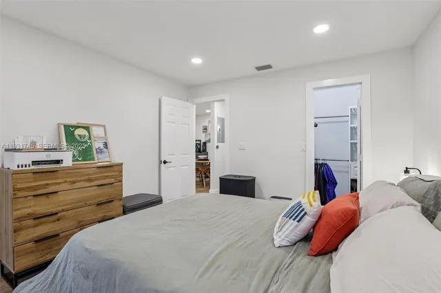 a bedroom with a bed and a closet