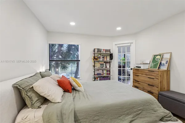 a bedroom with a bed and dresser