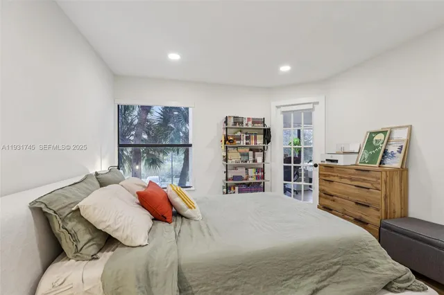 a bedroom with a bed and dresser