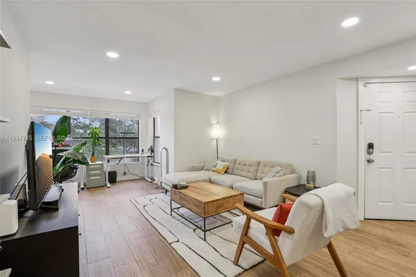 a living room with furniture or couch and a flat screen tv