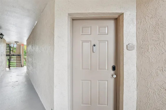 front view of a house with a garden