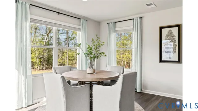 a view of a room with a window and dining area
