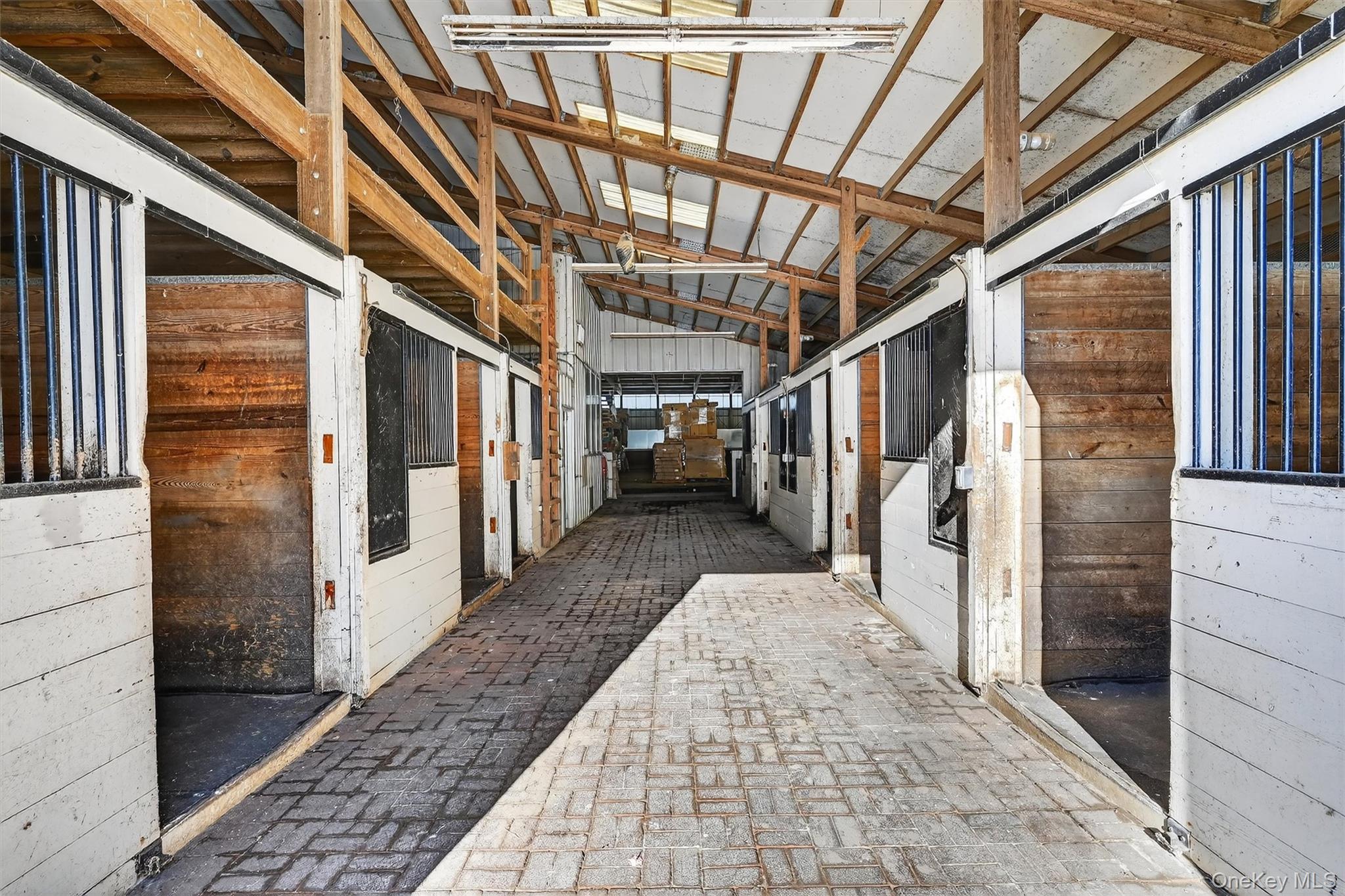 285 Hill Road Goshen, NY 10924 - Photo 35 of 49 One of two brick aisleway in the main barn. No going outside in inclement weather to get to the indoor!