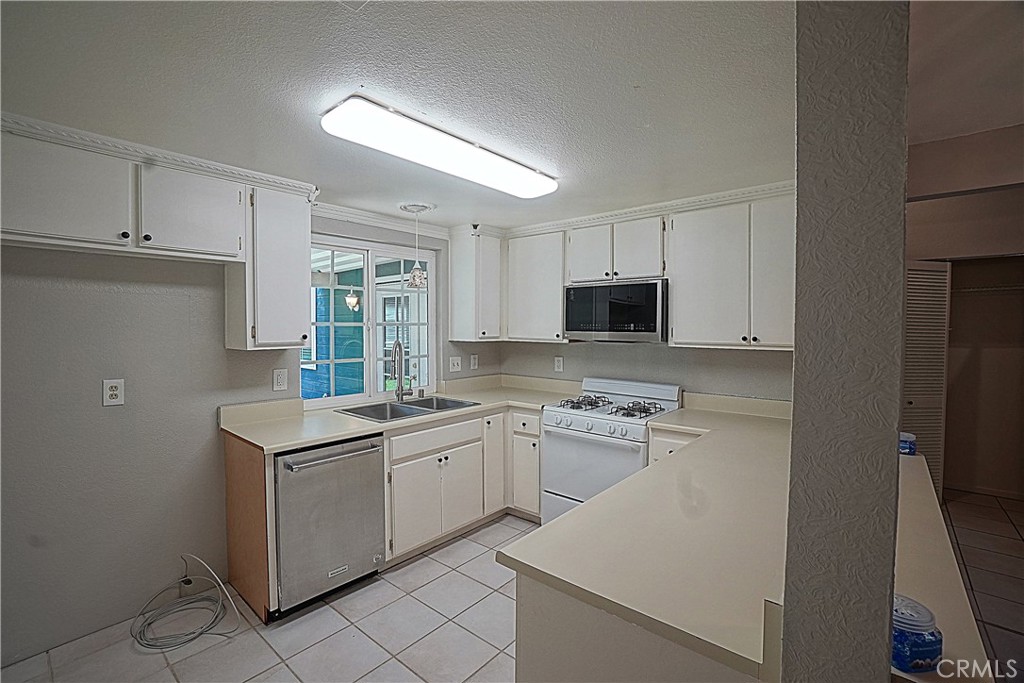 1152 Athena Court Riverside, CA 92507 - Photo 5 of 11 a kitchen with a sink appliances and cabinets