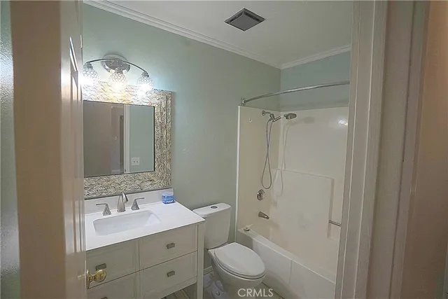 a bathroom with a double vanity sink toilet mirror and shower