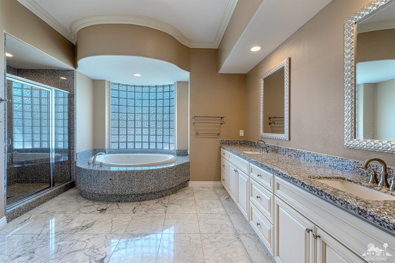 35 Sherwood Road Rancho Mirage, CA 92270 - Photo 11 of 25 a spacious bathroom with a granite countertop double vanity sink a mirror and a bathtub