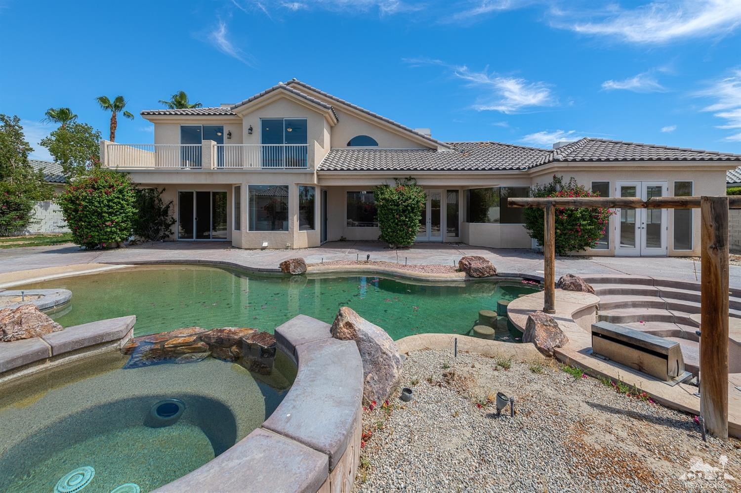 35 Sherwood Road Rancho Mirage, CA 92270 - Photo 15 of 25 a view of a house with a swimming pool