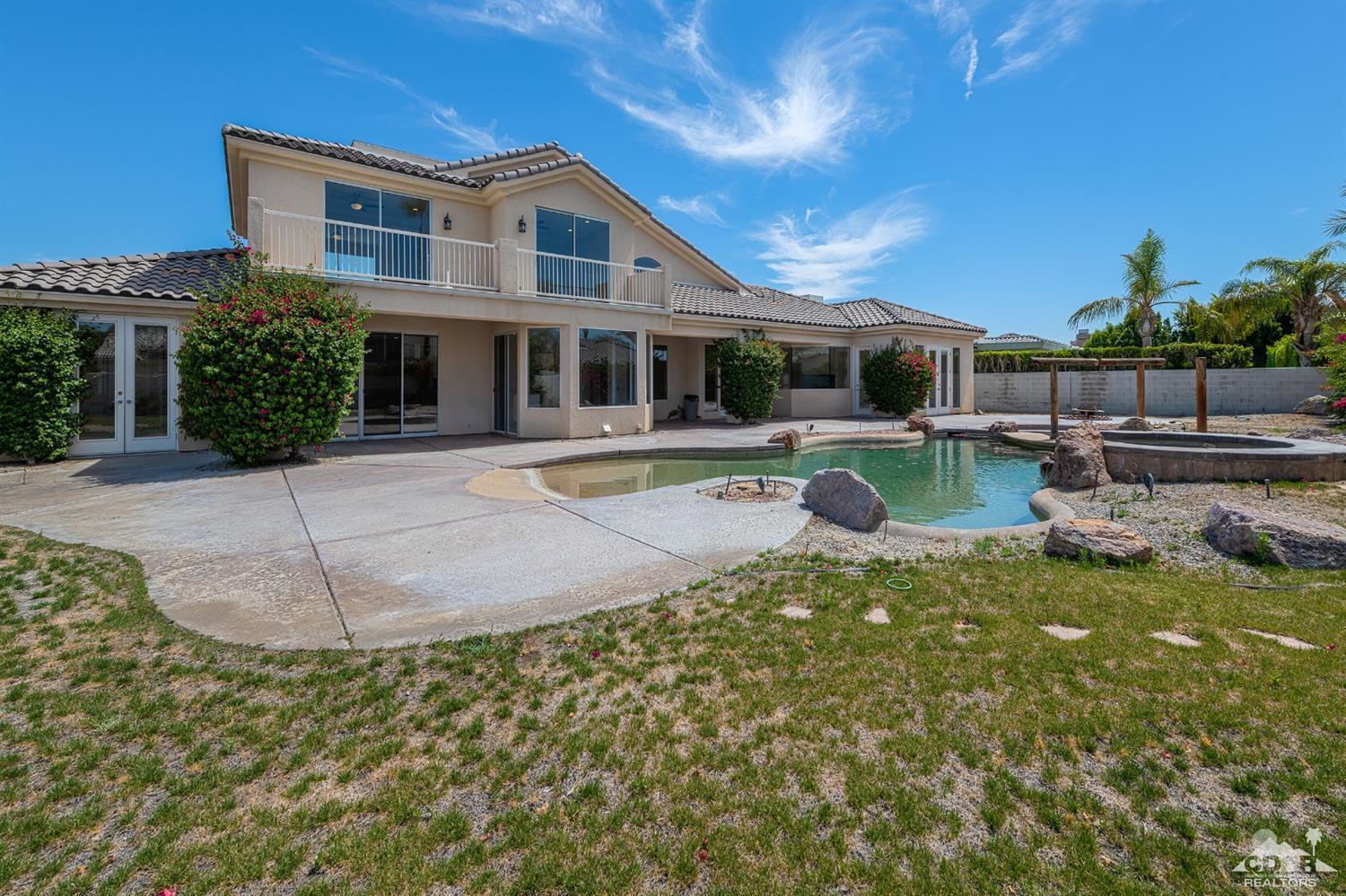 35 Sherwood Road Rancho Mirage, CA 92270 - Photo 17 of 25 a front view of a house with garden