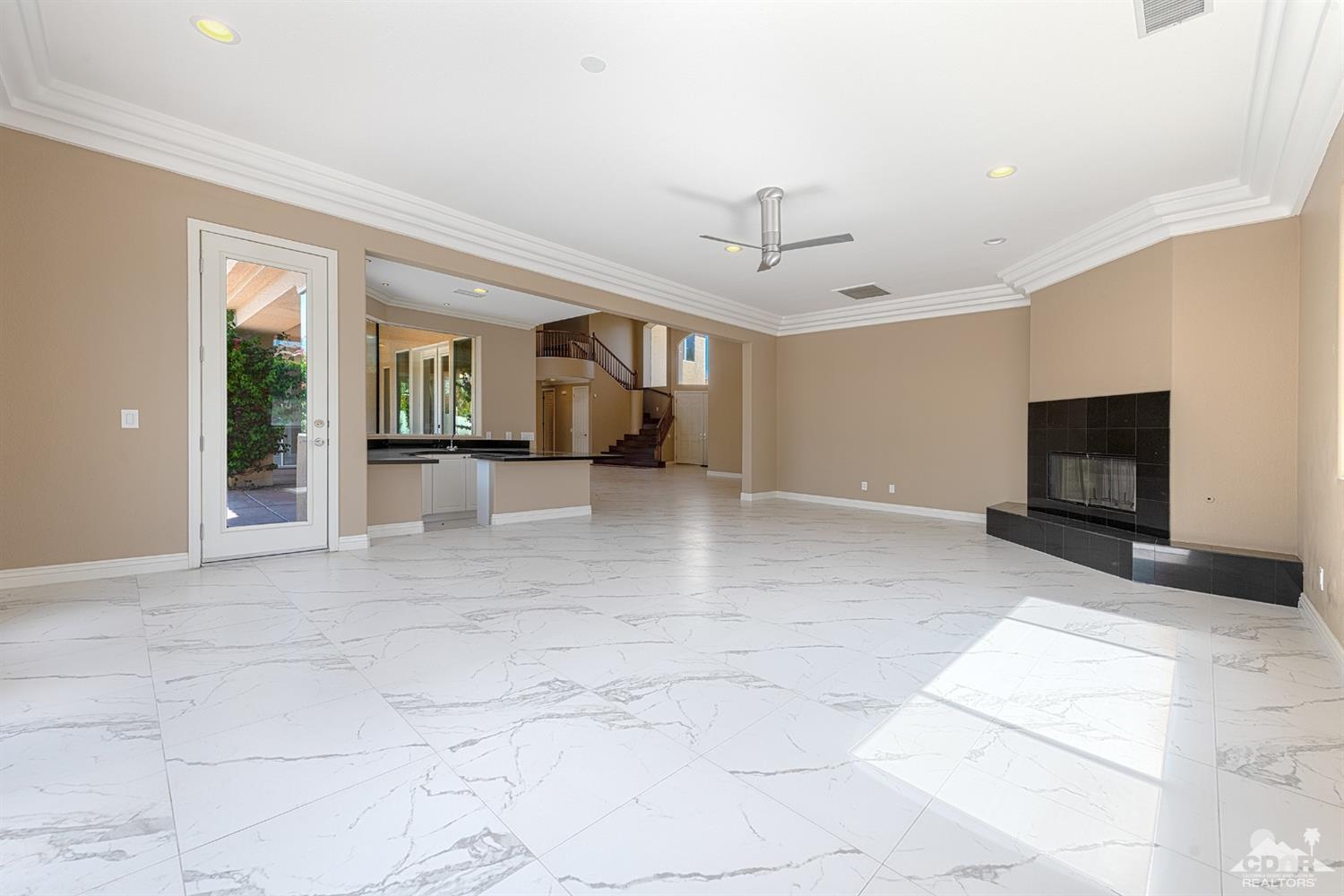 35 Sherwood Road Rancho Mirage, CA 92270 - Photo 6 of 25 a view of livingroom with hardwood floor and a fireplace