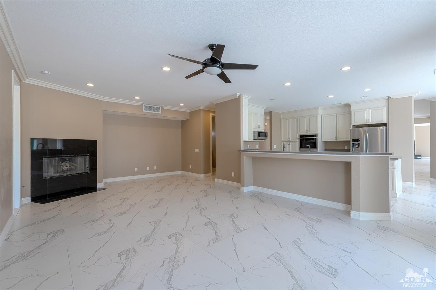 35 Sherwood Road Rancho Mirage, CA 92270 - Photo 9 of 25 a view of a kitchen with a sink and a refrigerator