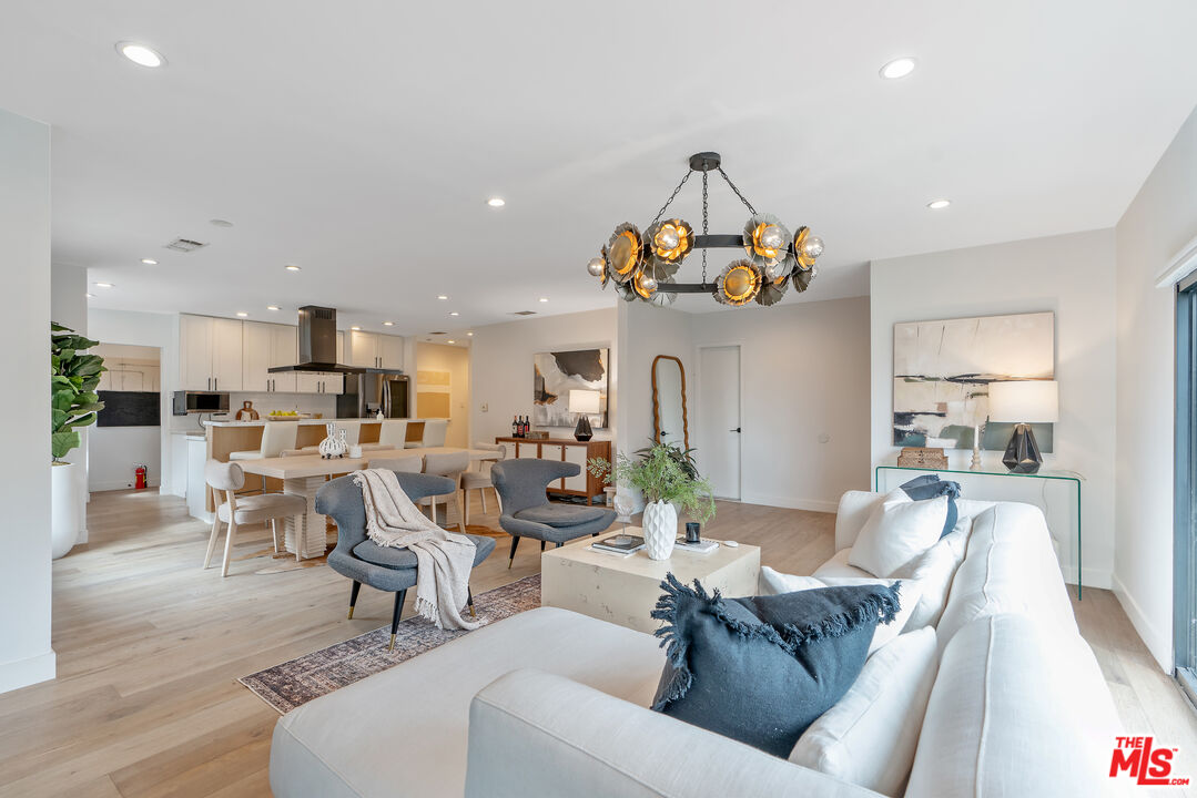 1645 South Sierra Bonita Avenue Los Angeles, CA 90019 - Photo 12 of 62 a living room with furniture and kitchen view