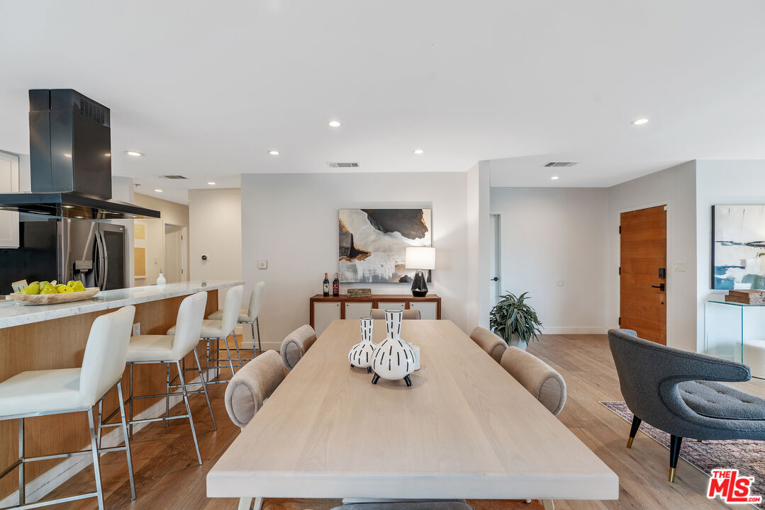 1645 South Sierra Bonita Avenue Los Angeles, CA 90019 - Photo 15 of 62 a living room with furniture and a flat screen tv