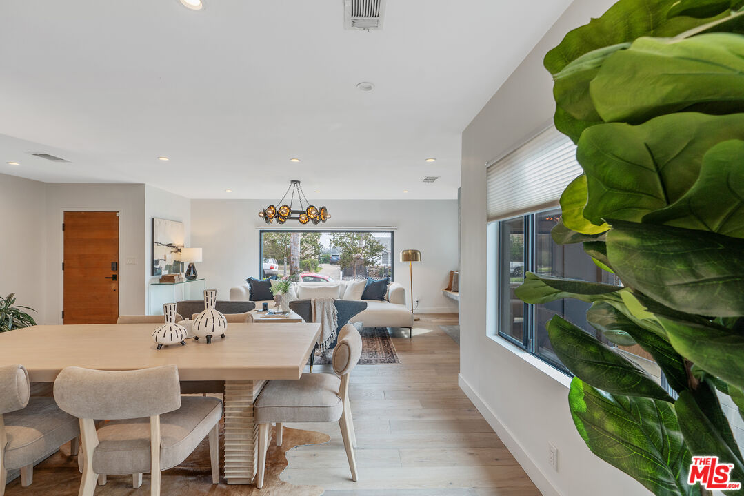 1645 South Sierra Bonita Avenue Los Angeles, CA 90019 - Photo 17 of 62 a view of a dining room with furniture