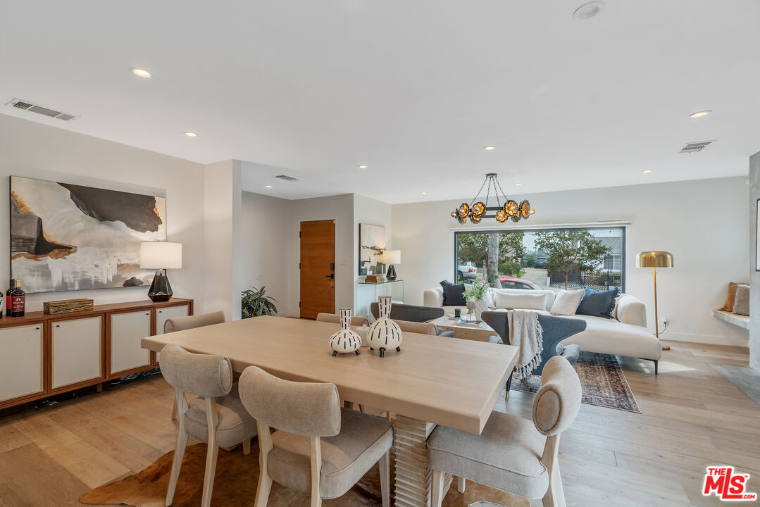 1645 South Sierra Bonita Avenue Los Angeles, CA 90019 - Photo 18 of 62 a view of a dining room with furniture window and wooden floor
